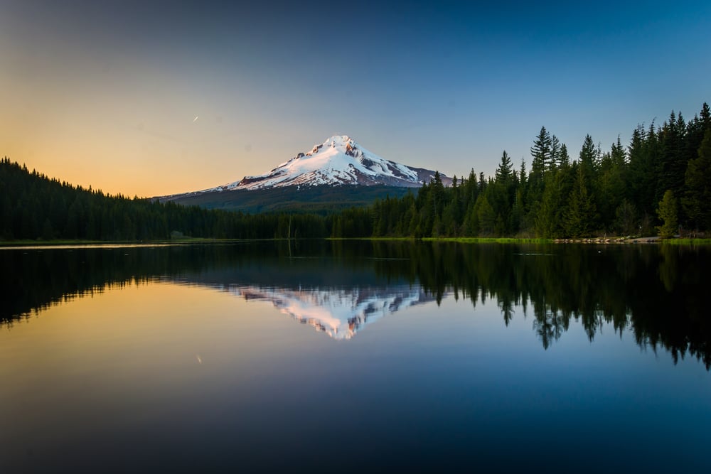 Mount Hood reflecting in Trillium Lake at sunset, in Mount Hood National Forest, Oregon.